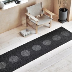 Tapis en plastique à pois noir